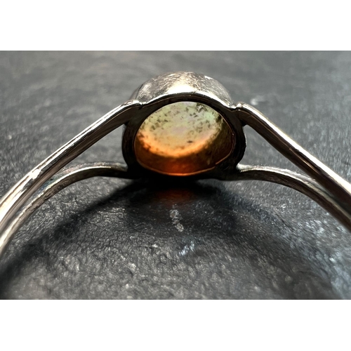 753 - An unmarked dress ring set with an opal, 1 gm, size K (tests as circa 9ct)