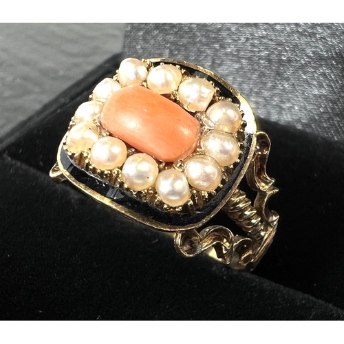 754 - A 19th century 15ct mourning ring set with a rectangular coral surrounded by 12 seed pearls in black... 