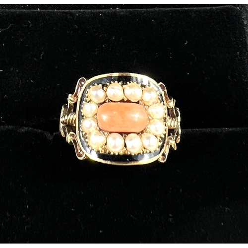 754 - A 19th century 15ct mourning ring set with a rectangular coral surrounded by 12 seed pearls in black... 