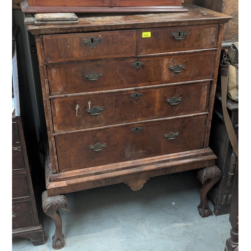 1054 - An early 18th century chest on stand with moulded cornice, 3 long and 2 short drawers with brass swa... 