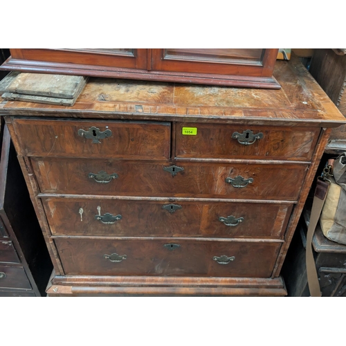 1054 - An early 18th century chest on stand with moulded cornice, 3 long and 2 short drawers with brass swa... 