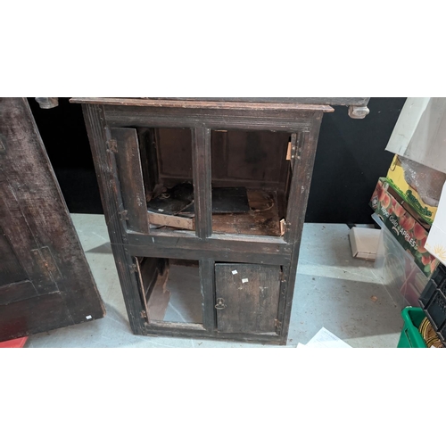 1068 - An 18th century carved oak occasional table with cupboard below; An 18th century straight front glaz... 