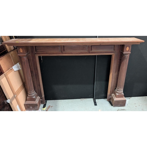 1099 - A large inlaid mahogany carved fireplace surround with turned columns, length 206cm, interior space ... 