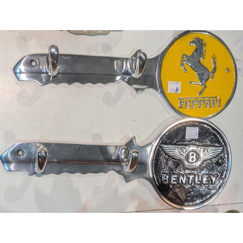 478A - Two automobile advertising wall mounting coat hooks, Ferrari and Bentley.