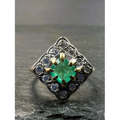 755 - An 18ct hallmarked gold diamond and emerald dress ring, the central emerald square cut and surrounde... 