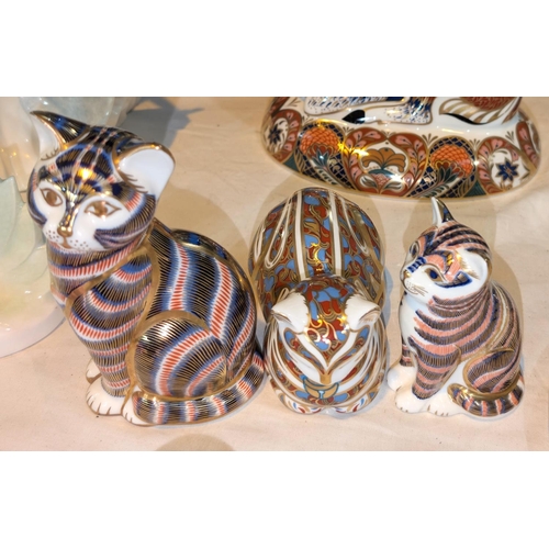 620 - Three Royal Crown Derby figures of cats.