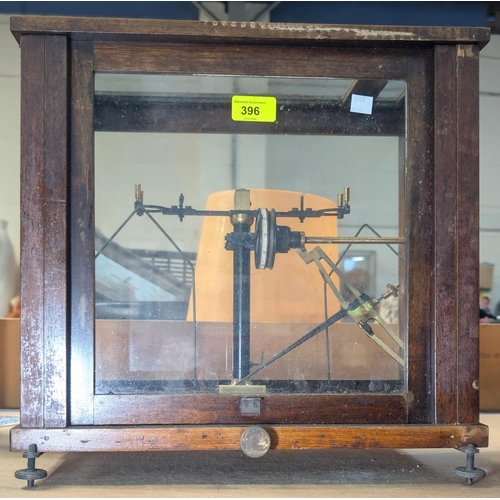 396 - A pair of laboratory scales in mahogany cabinet.