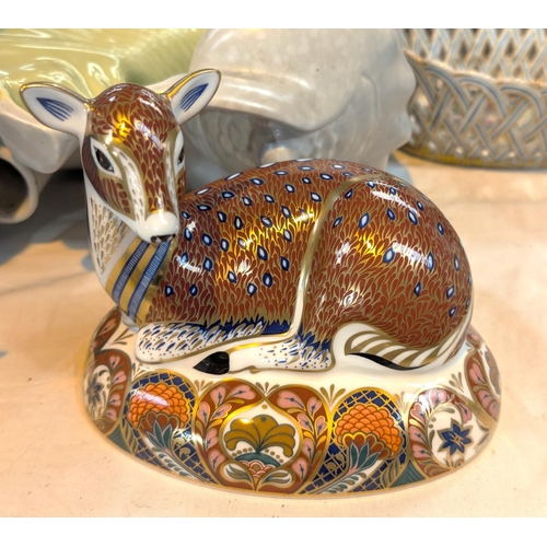 619 - A Royal Crown Derby figure of a reclining fawn.