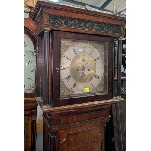 985 - An 18th Century oak longcase clock with cross banded decorated, the door with reeded columns, 1/4 re... 