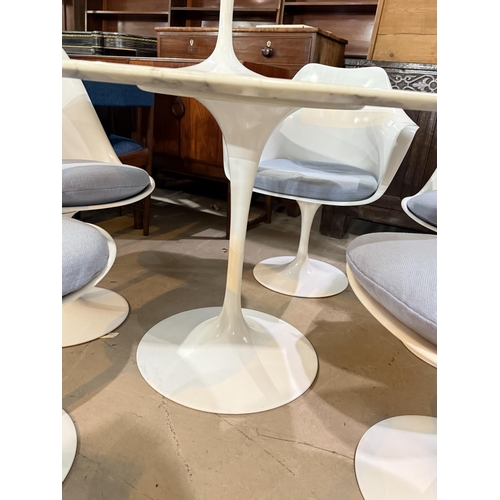 1076 - A 1960's Eero Saarinen designed white and grey veined dining table on turned column and flared foot,... 