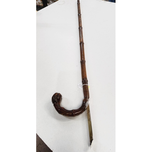 161 - A 19th Century cane walking stick with concealed horse measure having white metal cover, 91cm.