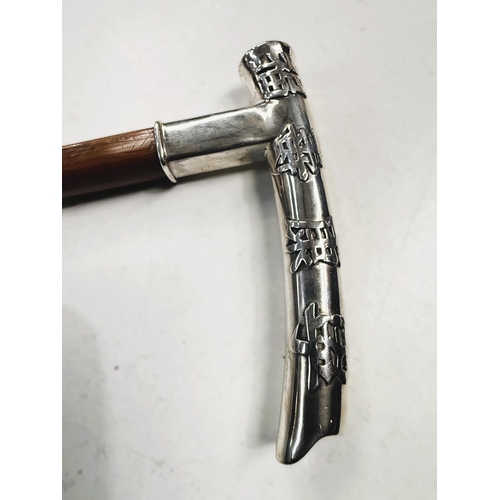 181 - A Chinese square section cane, circa 1900, with silver handle, 91cm.