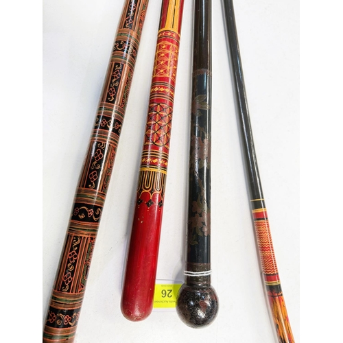 26 - A Japanese black lacquer walking stick with cloisonne decoration, 89cms, and three Indian lacquer st... 