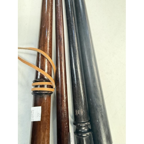 27 - An early 20th Century turned hardwood parade ground stick, 88cms, and three others (4).