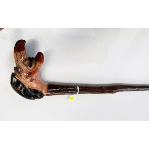 72 - A 19th Century carved stick, possibly continental, with painted wood handle of 'Punchinello', 94cm.