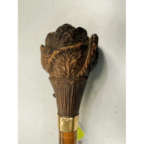 185 - A 19th Century Black Forest carved wood novelty stick finial with rabbit leaping from cabbage, with ... 