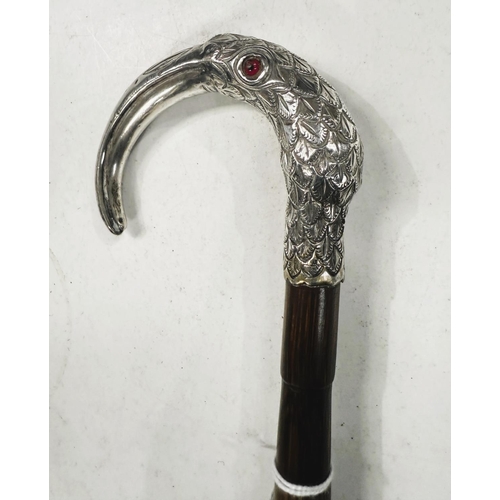 225 - A 19th Century lady's walking cane with white metal loop handle in the form of a hornbill, 87cm.