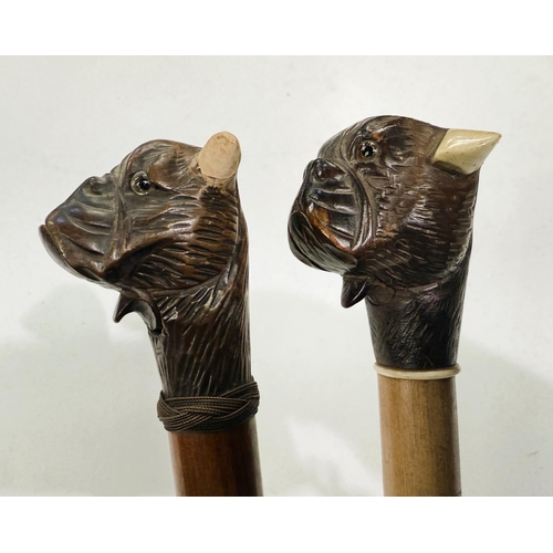 167 - An early 20th Century stick with carved wood finial of a bulldog with 'jaw clicker', 90cm, and anoth... 