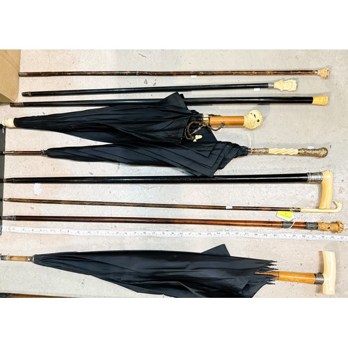 1 - A group of 19th Century sticks and umbrellas with ivory mounts (9).