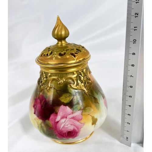 713 - A Royal Worcester baluster covered pot pourri vase, hand painted with roses, ht. 14cm.