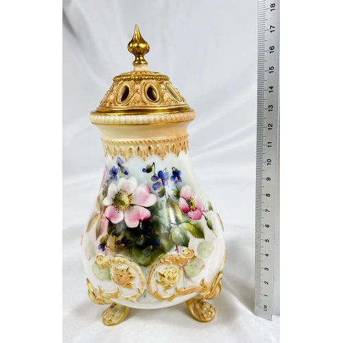 714A - A Royal Worcester covered baluster pot pourri vase on 3 raised paw feet, hand painted with flowers, ... 