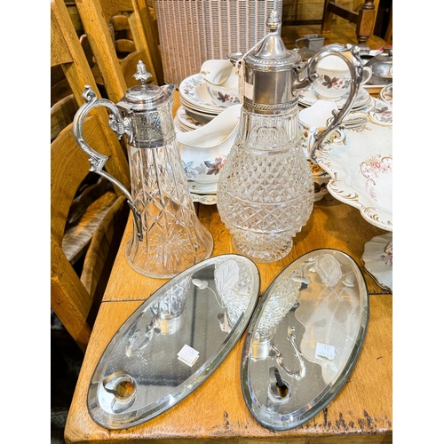 751 - Two claret jugs with silver plated mounts; a pair of etched small Victorian wall mirrors.