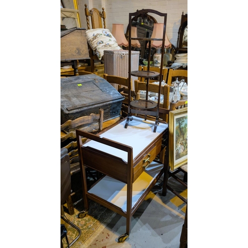 951 - An oak three height folding cake stand; a corner Lloyd Loom linen basket; a 2 tier wood and white la... 