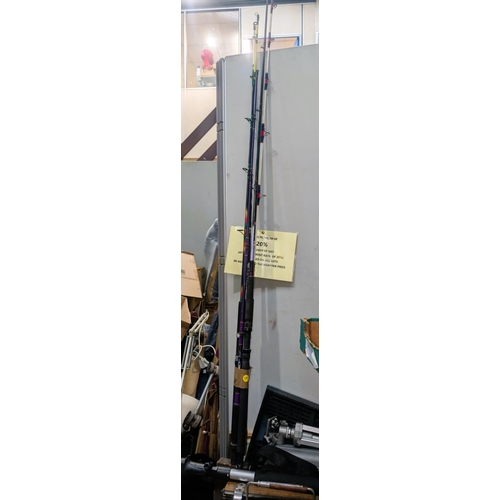 390A - A collection of vintage fishing equipment including rods etc