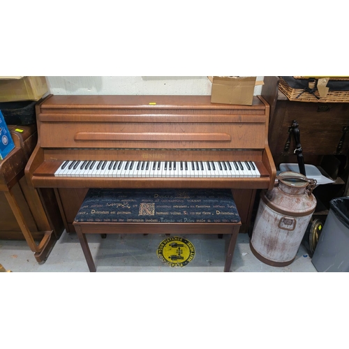 1012 - A good quality Bentley teak cased small upright piano with stool.