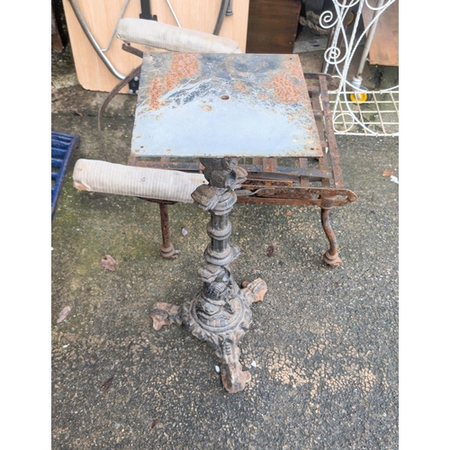 1052A - A cast metal column base with fish on tripod base and a vintage metal campaign style chair