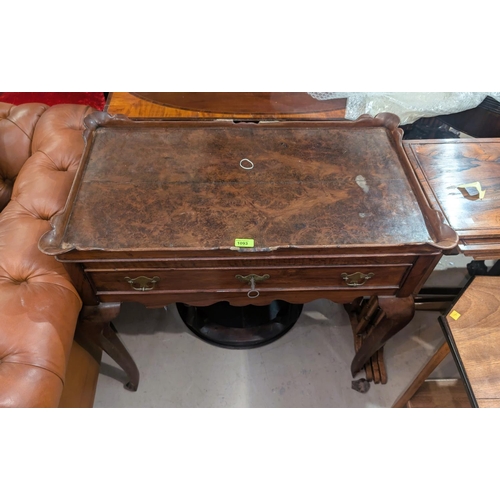 1093 - A 19th century occasional table with burr walnut basin top with raised scalloped edges, four cabriol... 