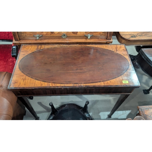 1096 - A late Georgian inlaid mahogany card table.