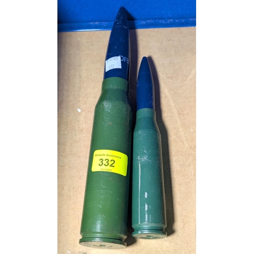 25 - A shell case drill rounds 28.5cm, another 20.5cm.