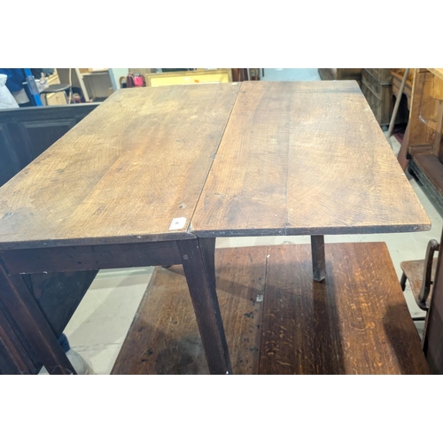 1002 - A Georgian mahogany drop leaf dining table on chamfered legs, extended length 152cm; a similar small... 