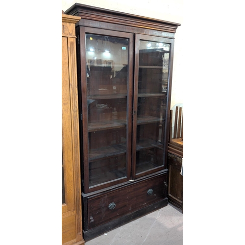 1017 - A late 19th/early 20th century mahogany full height display cabinet enclosed by 2 glazed doors with ... 