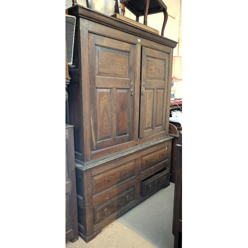 1018 - An 18th century oak full height bacon/housekeepers cupboard with moulded cornice, 2 doors with raise... 