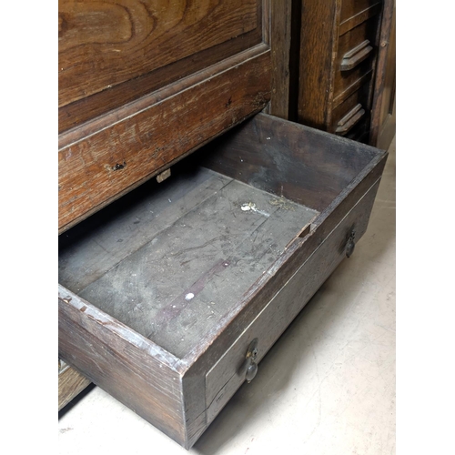 1018 - An 18th century oak full height bacon/housekeepers cupboard with moulded cornice, 2 doors with raise... 