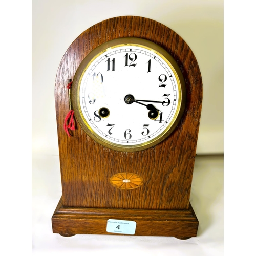 4 - An oak cased striking mantel clock, inlaid decoration; another mantel clock with boxwood inlay.