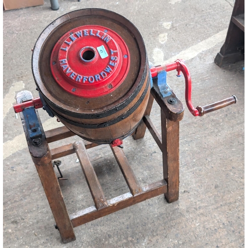 41 - A Llewellin Haverfordwest barrel butter churn with painted metalwork.