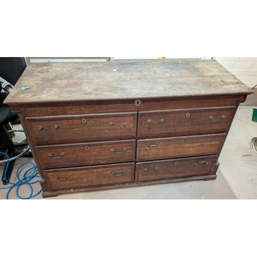 1006 - An 18th century country made crossbanded oak Lancashire chest with hinged top, 4 short drawers and 2... 