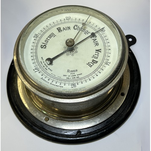 13 - A British made ships clock and ships barometer, 18 and 20cm.