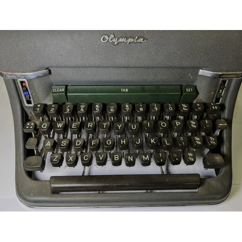 31 - A vintage Olympia typewriter, fountain pens etc.