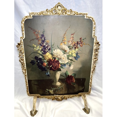 37 - An embossed slope front brass coal box; a coal scuttle; a jam pan and floral fire screen.