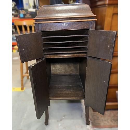 40 - An early 20th century HMV oak-cased gramophone cabinet.