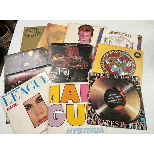 253 - A collection of 1970's records, Rolling Stones, David Bowie etc.