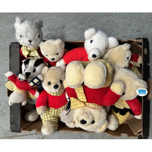 265 - A vintage Steiff cat with label to ear and a selection of Rupert Bears.