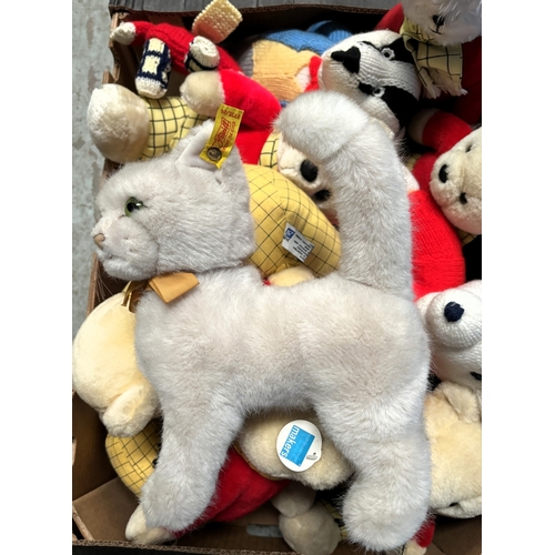 265 - A vintage Steiff cat with label to ear and a selection of Rupert Bears.