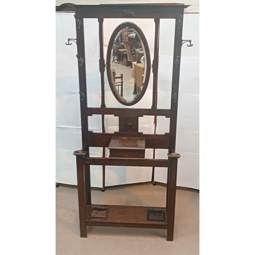 795 - Oak hall stand with adjustable mirror and original coat hooks, width 93cm, depth 33cm height 195cm; ... 