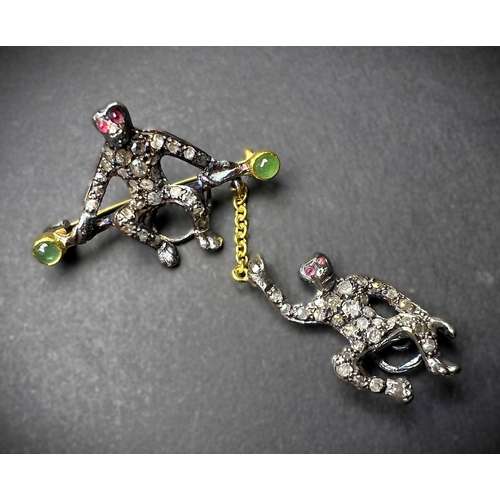 630 - A Victorian design novelty brooch of 2 monkeys, one seated, the other suspended on a chain, diamond ... 