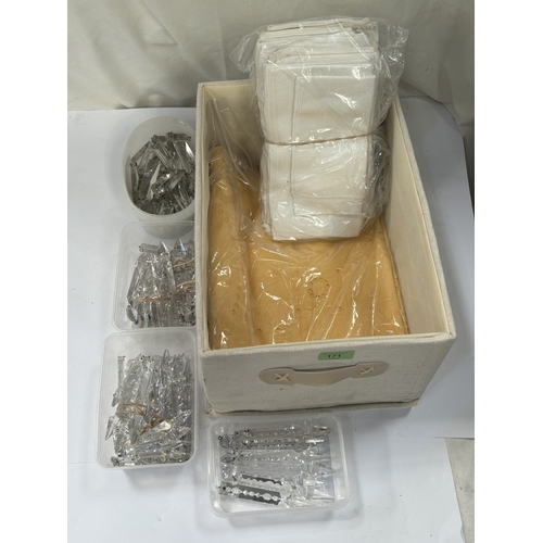 171 - A large selection of chandelier lustres, a hand worked cane coloured linen tablecloth, other napery.